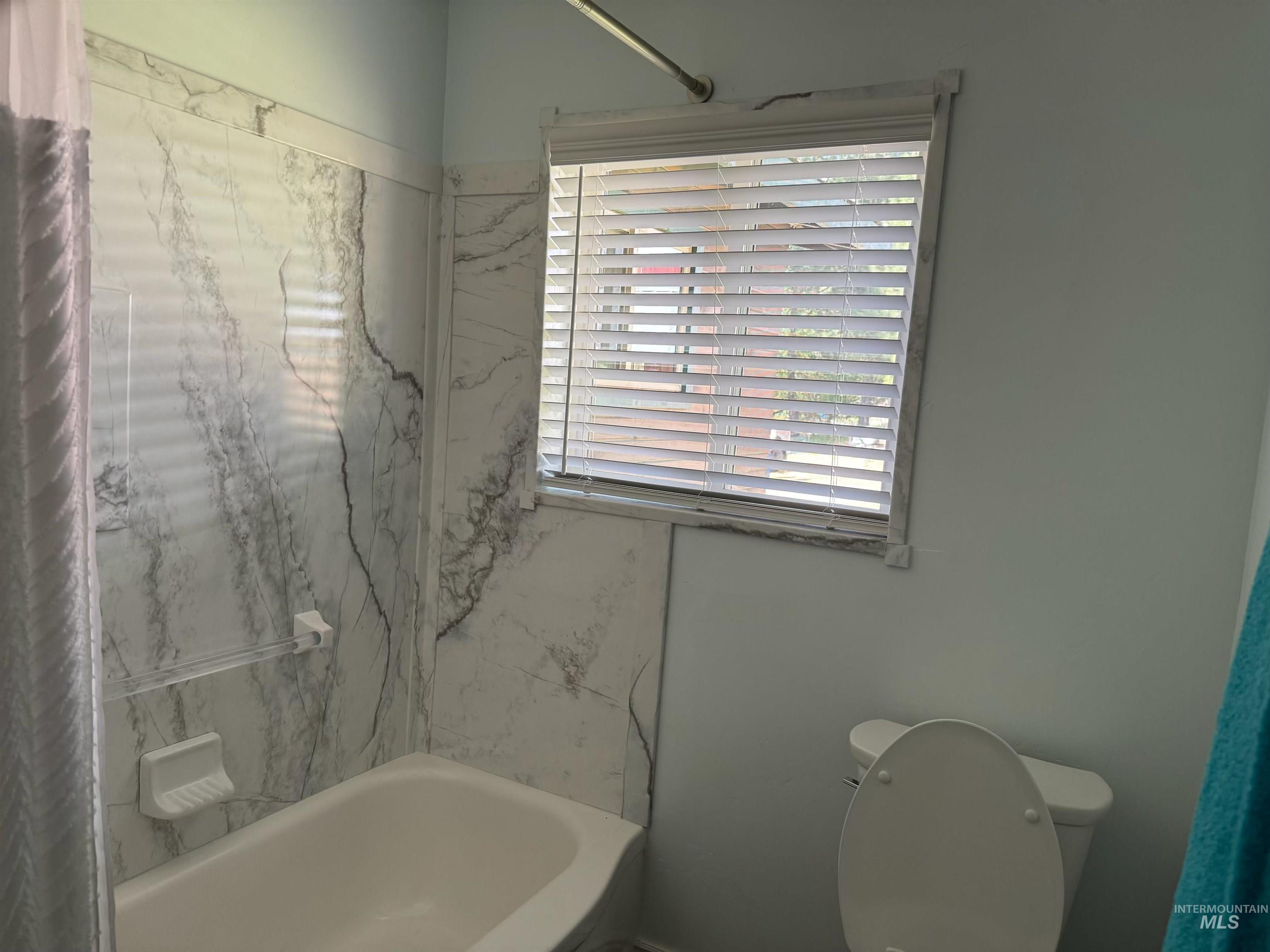 643 South Main Street Cascade, ID 83611 - Photo 19 of 38 Bathroom featuring toilet and shower / bath combo