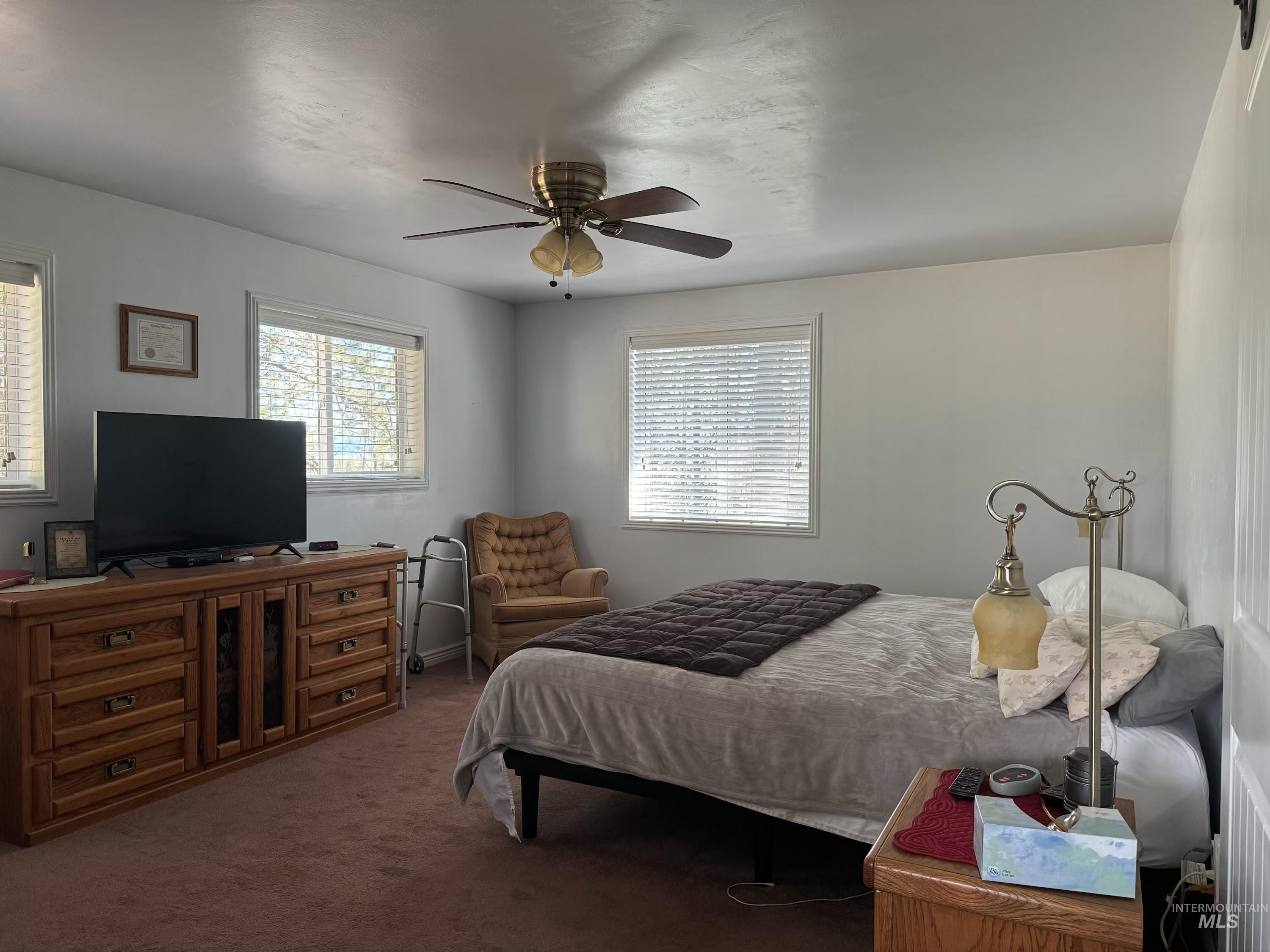 643 South Main Street Cascade, ID 83611 - Photo 20 of 38 Carpeted bedroom with a ceiling fan