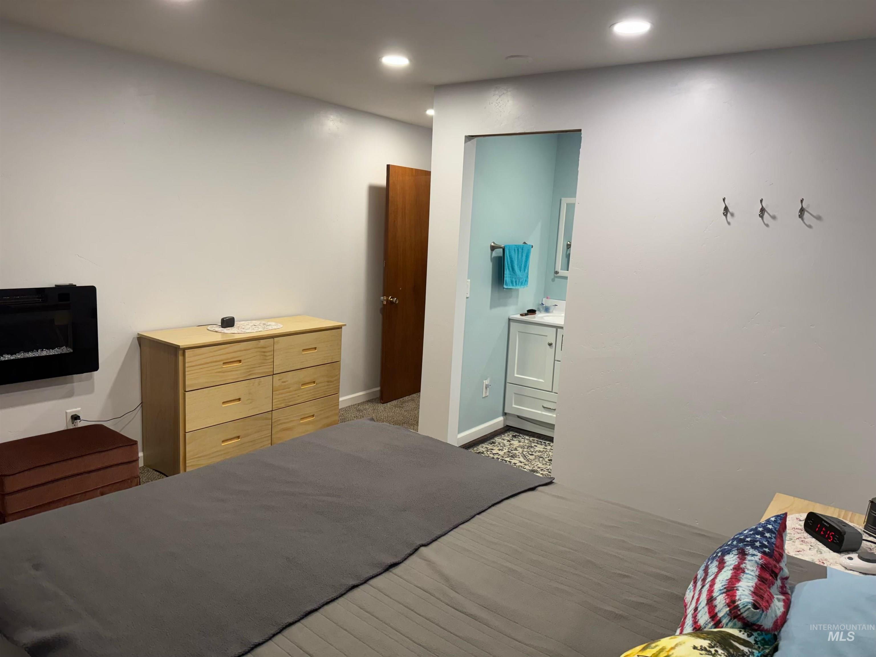 643 South Main Street Cascade, ID 83611 - Photo 28 of 38 Bedroom with recessed lighting, light wood finished floors, and ensuite bathroom
