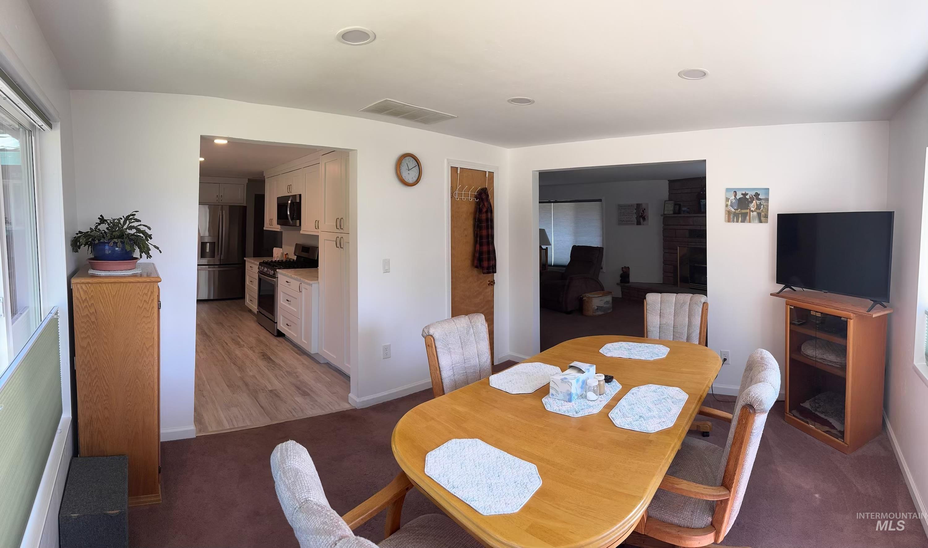 643 South Main Street Cascade, ID 83611 - Photo 10 of 38 Dining room featuring light carpet and baseboards