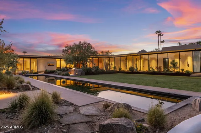 a view of swimming pool with outdoor seating