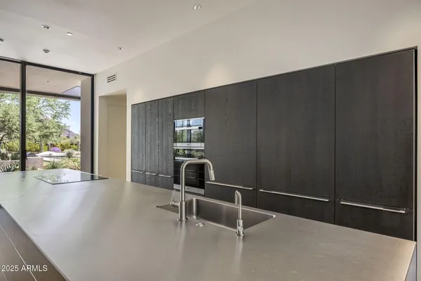 a living room with furniture and a painting on the wall