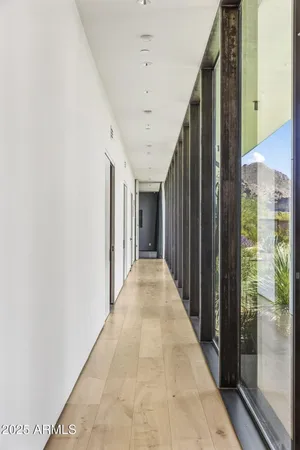 a bedroom with furniture and a large window