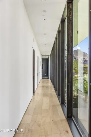 a bedroom with furniture and a large window