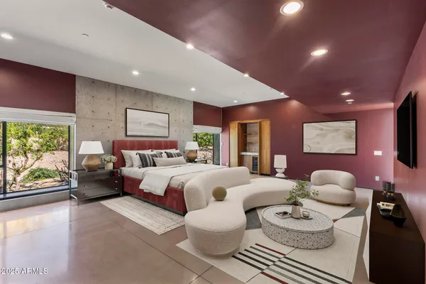 a bathroom with a tub a sink and a large mirror