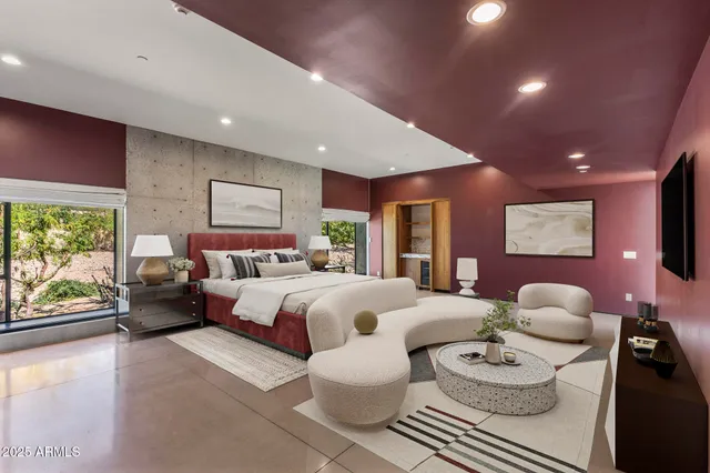 a bathroom with a tub a sink and a large mirror