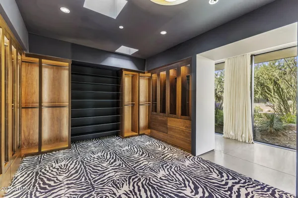 a view of a terrace with a garden and trees