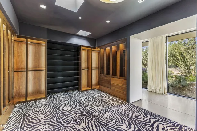 a view of a terrace with a garden and trees