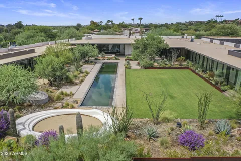 a view of a swimming pool with a yard