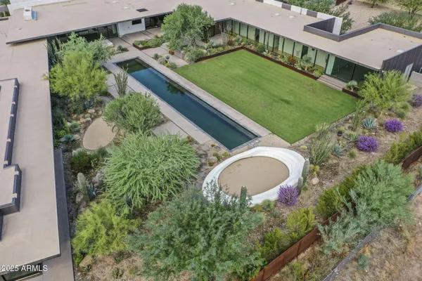 a view of a swimming pool and trees in the background