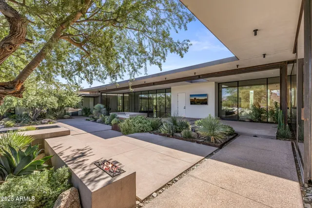 a backyard of a house with lots of green space