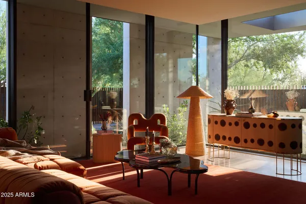 a open kitchen with stainless steel appliances kitchen island granite countertop a refrigerator a stove and a sink with granite countertops