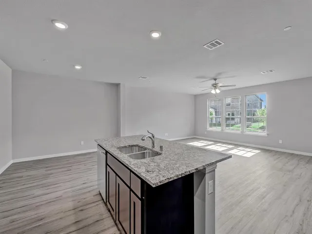 a view of a house with a yard and garage