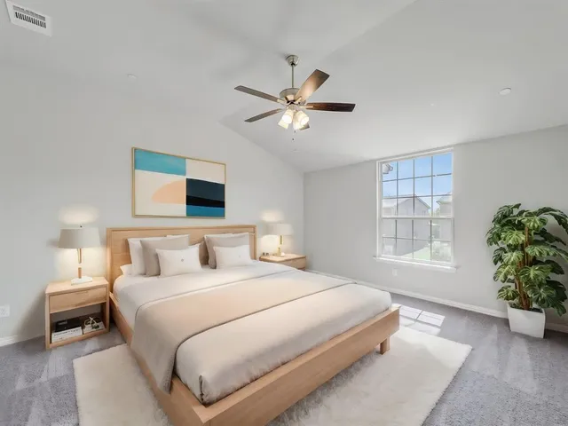 a kitchen with granite countertop a sink a counter space and cabinets
