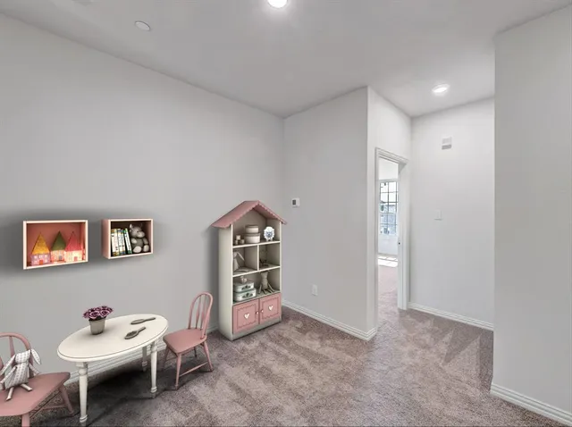 a livingroom with furniture and a potted plant