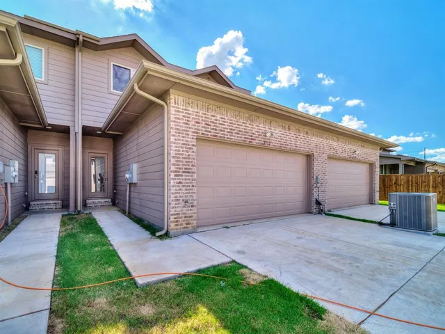 a view of walk in closet with clothes