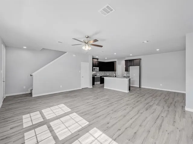 a view of kitchen with furniture and microwave