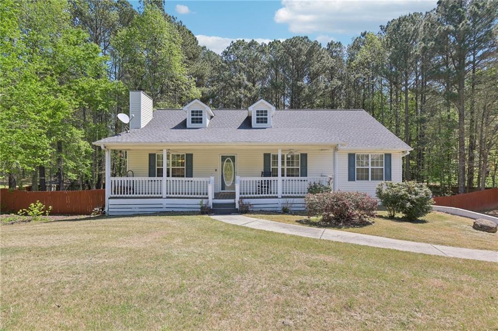 29 Wey Bridge Court White, GA 30184 - Photo 1 of 15 a front view of a house with a yard and garage