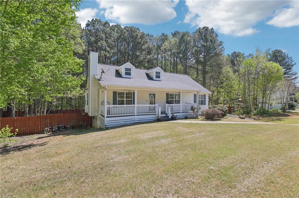 29 Wey Bridge Court White, GA 30184 - Photo 2 of 15 a front view of a house with a yard and trees