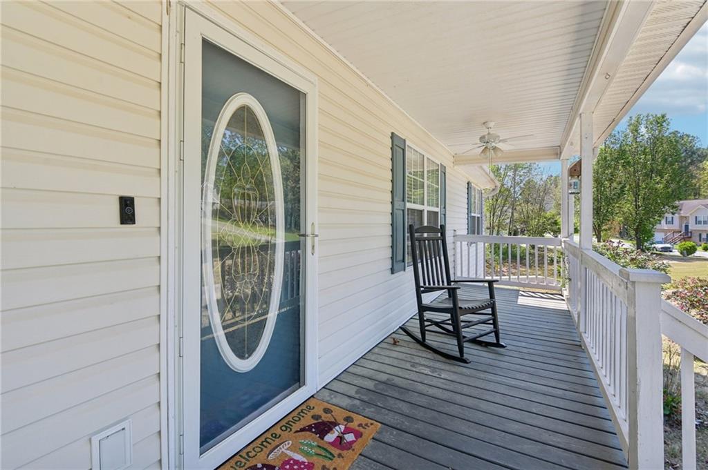 29 Wey Bridge Court White, GA 30184 - Photo 4 of 15 a view of a balcony with chairs and wooden floor