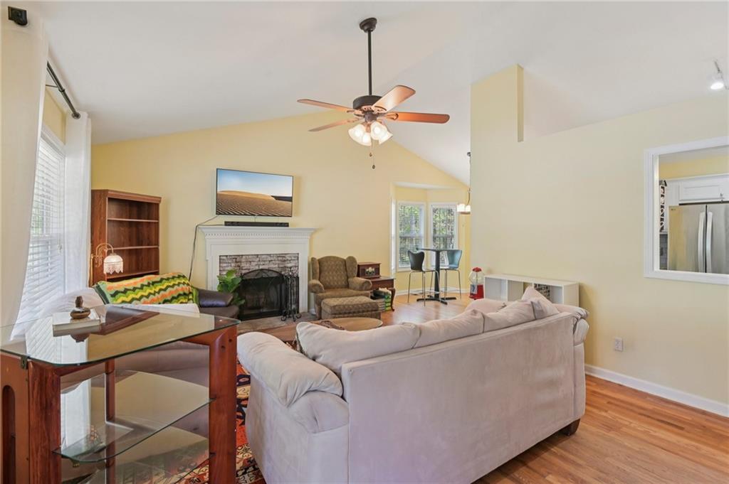 29 Wey Bridge Court White, GA 30184 - Photo 8 of 15 a living room with furniture a fireplace and a flat screen tv
