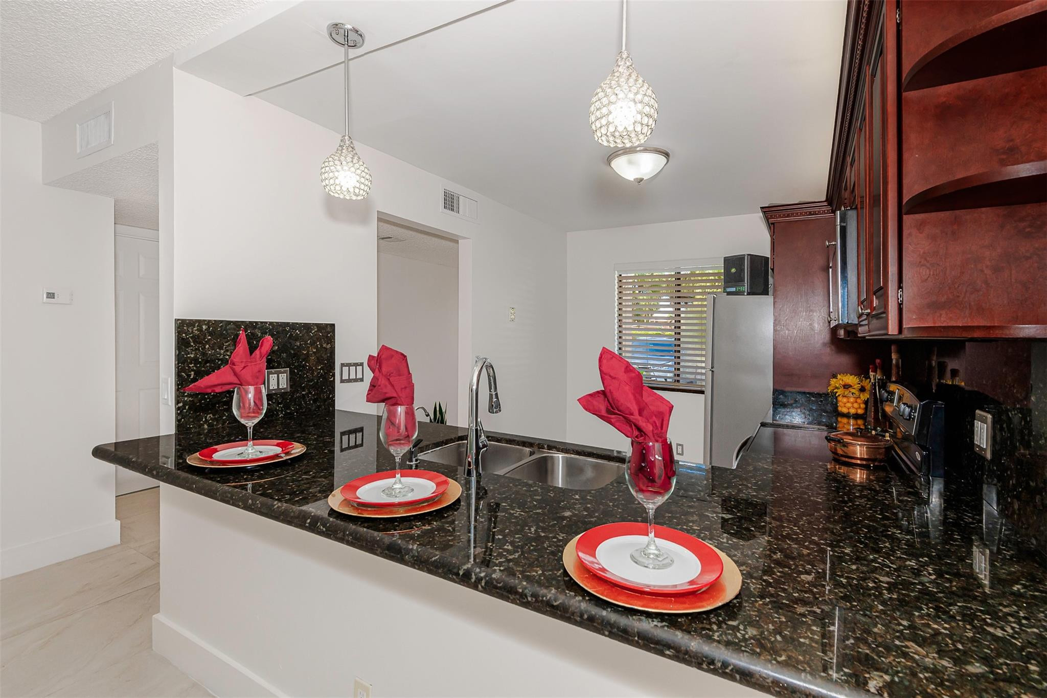 340 Racquet Club Road, Unit 101 Weston, FL 33326 - Photo 11 of 29 a floor to ceiling room and a view of kitchen