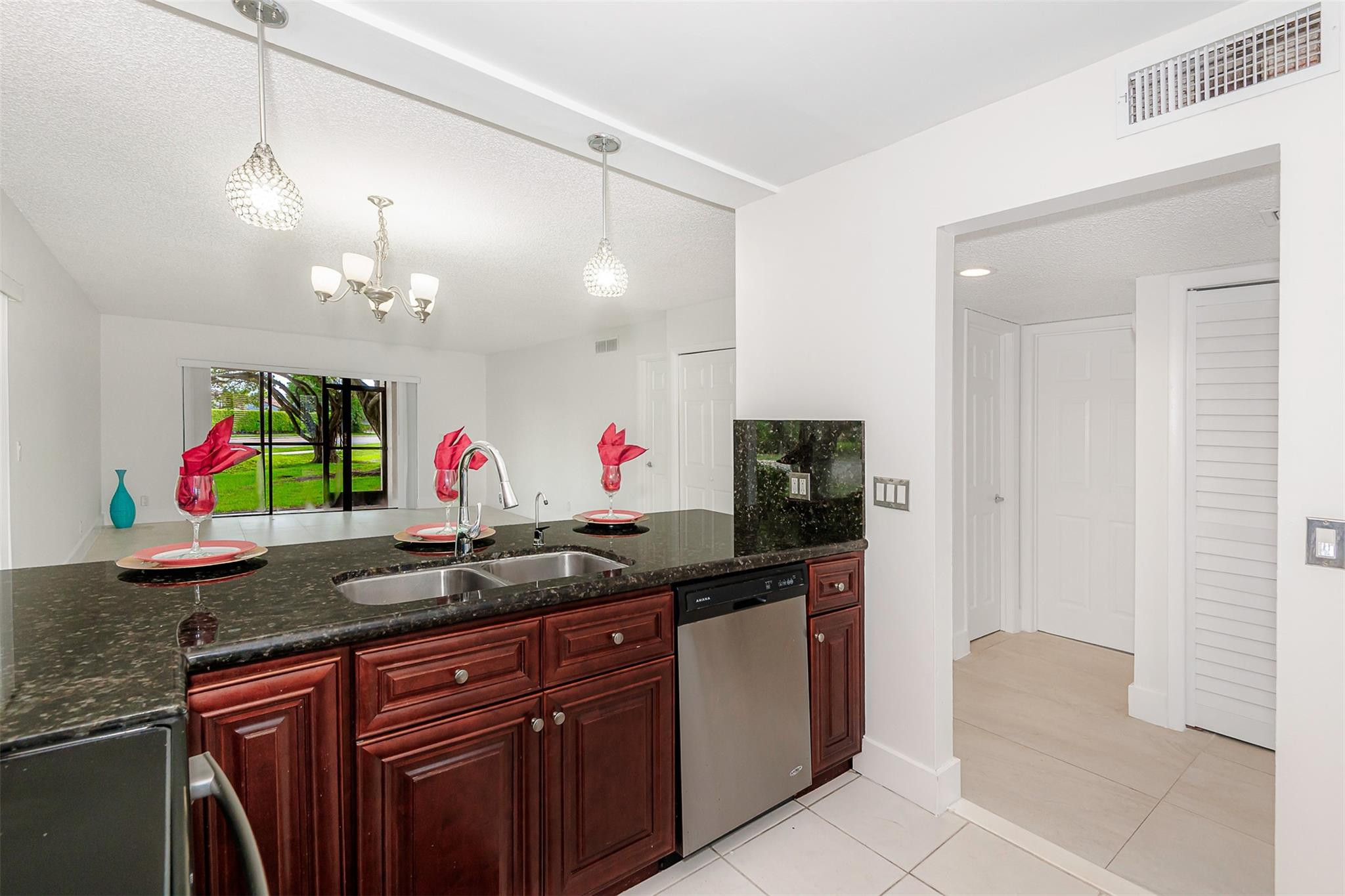 340 Racquet Club Road, Unit 101 Weston, FL 33326 - Photo 14 of 29 a view of a kitchen with appliances and cabinets