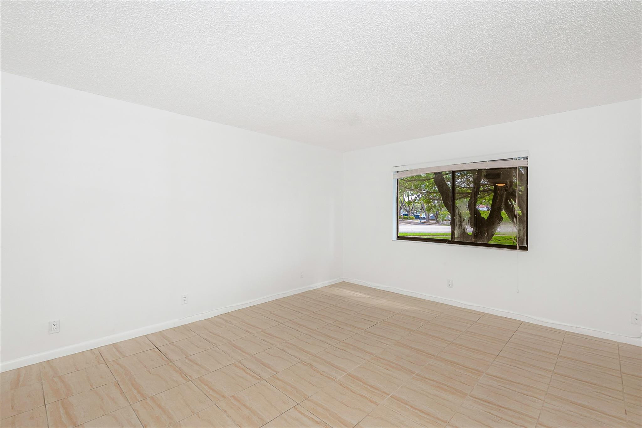 340 Racquet Club Road, Unit 101 Weston, FL 33326 - Photo 17 of 29 wooden floor in a empty room