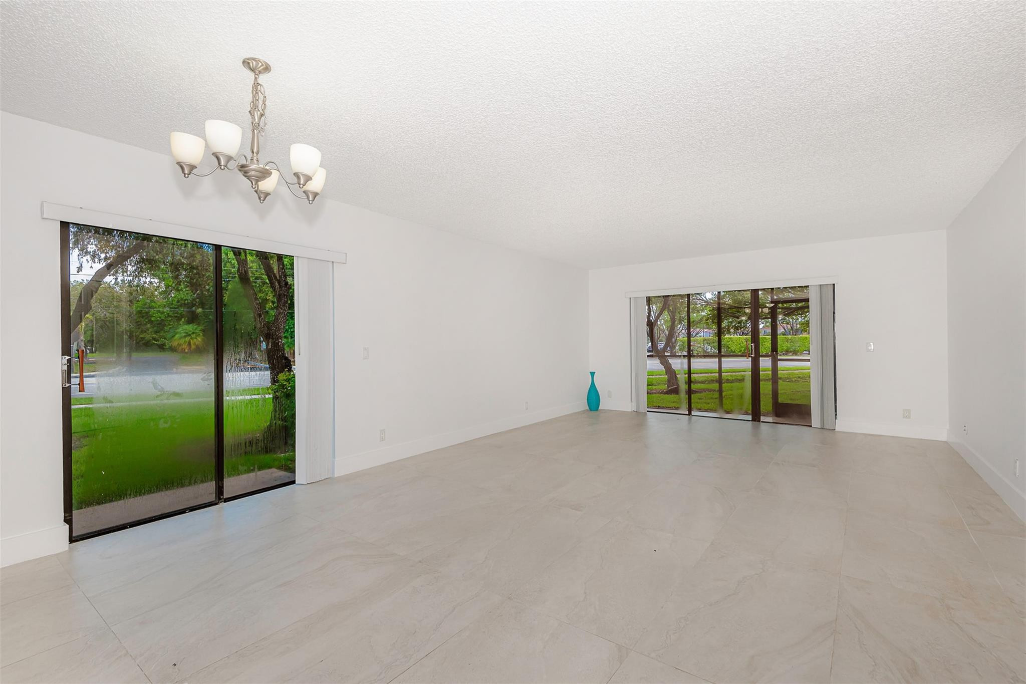 340 Racquet Club Road, Unit 101 Weston, FL 33326 - Photo 2 of 29 a view of an empty room with a window