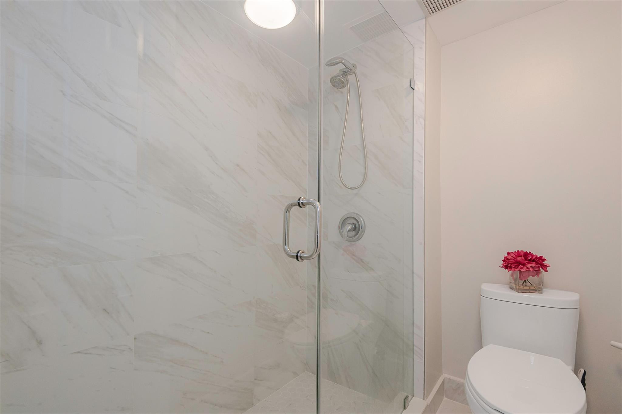 340 Racquet Club Road, Unit 101 Weston, FL 33326 - Photo 21 of 29 a bathroom with a toilet and a shower