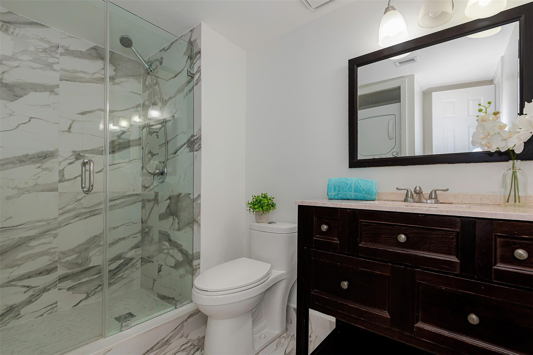 340 Racquet Club Road, Unit 101 Weston, FL 33326 - Photo 25 of 29 a bathroom with a sink a toilet and shower