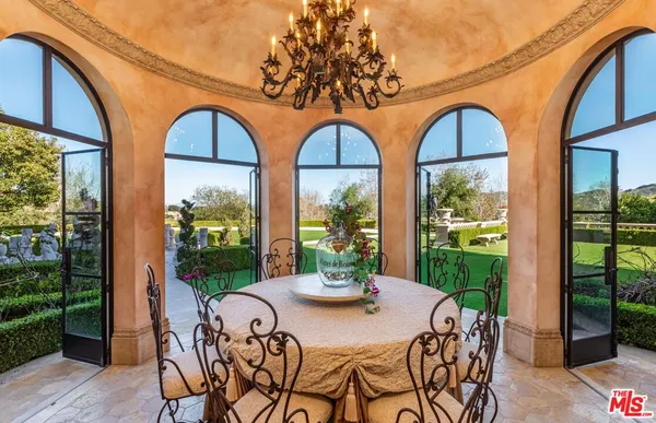 a view of an chairs and table in the patio