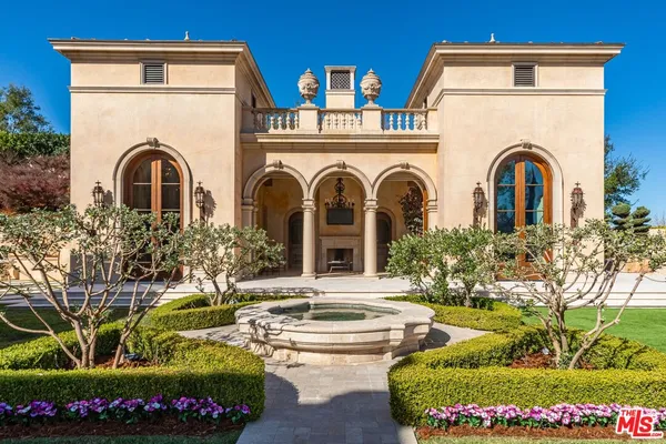 a bedroom with a bed and a mirror