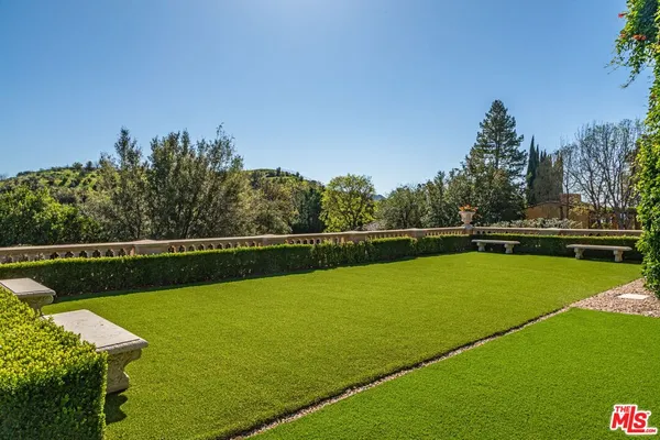 a view of house with a swimming pool