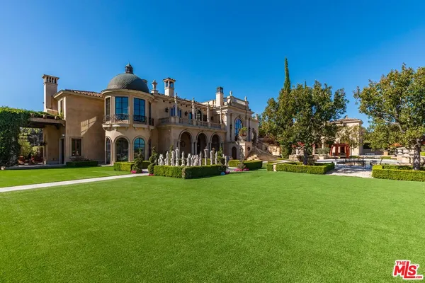 an aerial view of a house with a garden