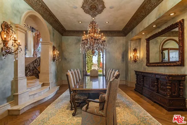 a view of a livingroom with furniture and a chandelier