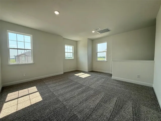 a room with chair and window