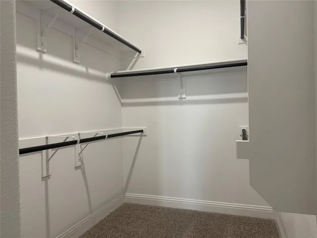 a spacious bathroom with a shower and a sink