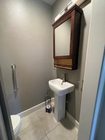 a bathroom with a sink and mirror