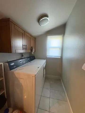 a utility room with washer and dryer