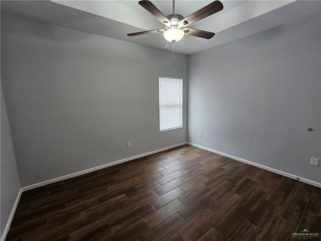 3400 Frio Avenue, Unit 1 McAllen, TX 78504 - Photo 5 of 7 an empty room with wooden floor and ceiling fan
