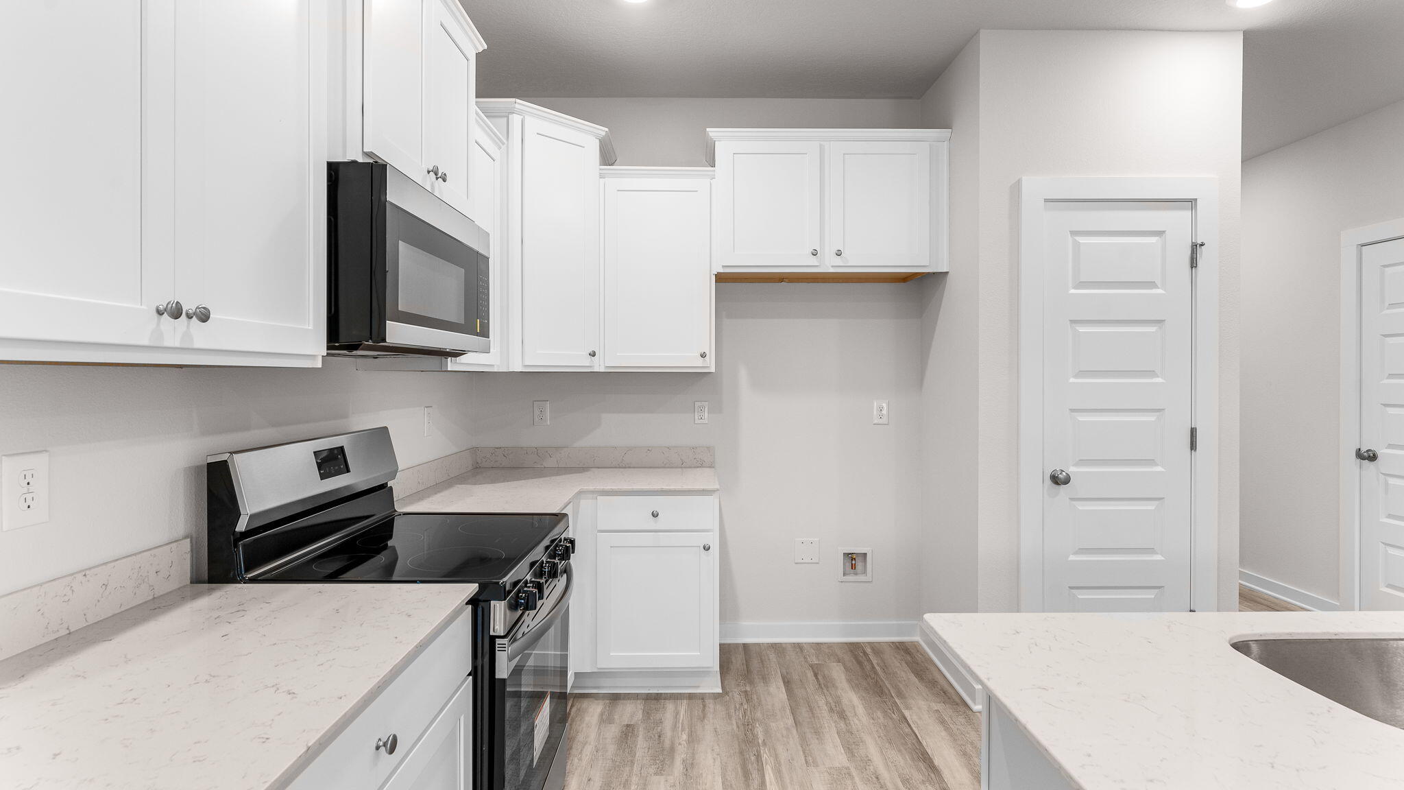 41 South Main Deck Drive Freeport, FL 32439 - Photo 13 of 30 a kitchen with a sink a stove and cabinets