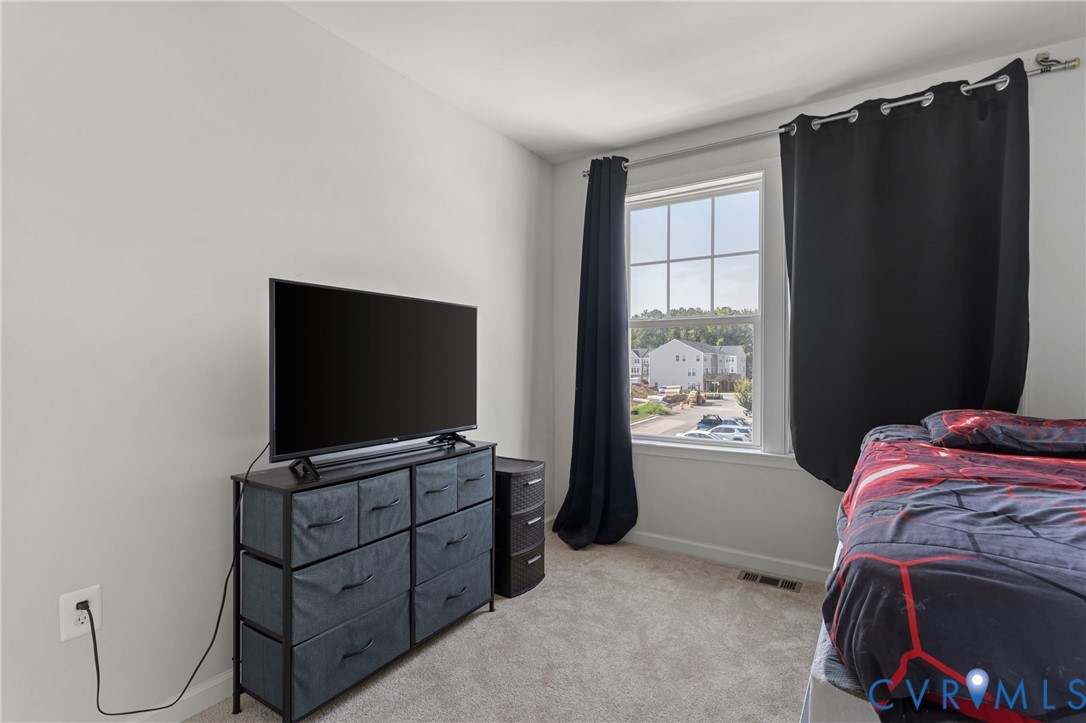 640 Rivanna Hill Road Glen Allen, VA 23060 - Photo 27 of 37 Bright bedroom featuring large window with natural