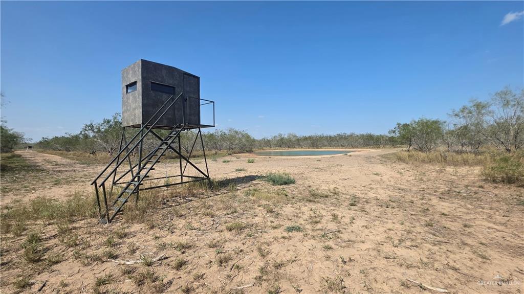 17391 Chapa Road Edinburg, TX 78542 - Photo 17 of 23 a view of a lake with a yard