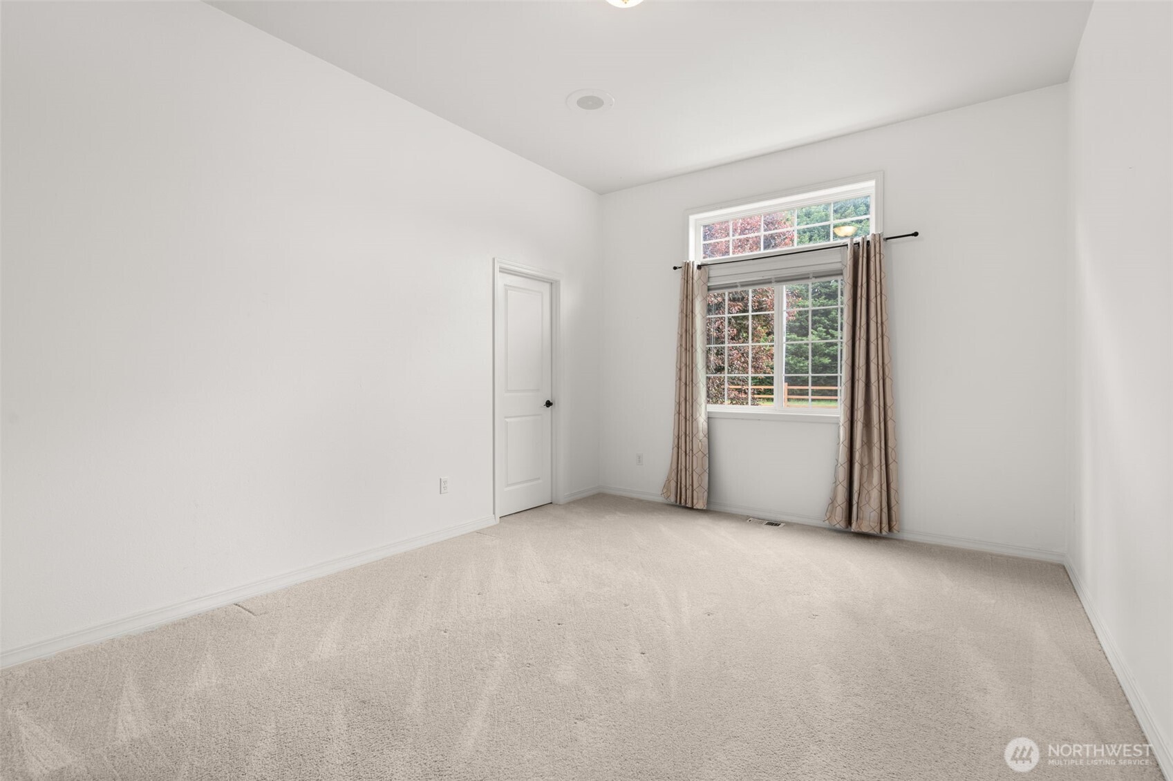 9609 346th Street South Roy, WA 98580 - Photo 20 of 37 a view of an empty room with a window
