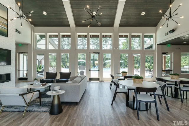 a kitchen with stainless steel appliances granite countertop a stove a sink island and a refrigerator