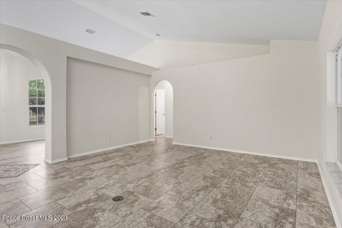 2405 Ruffner Road Melbourne, FL 32901 - Photo 12 of 35 an empty room with a natural light