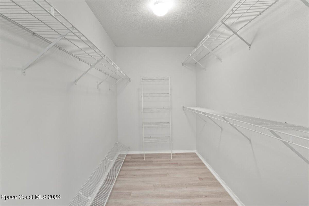 2405 Ruffner Road Melbourne, FL 32901 - Photo 21 of 35 a view of walk in closet with empty racks