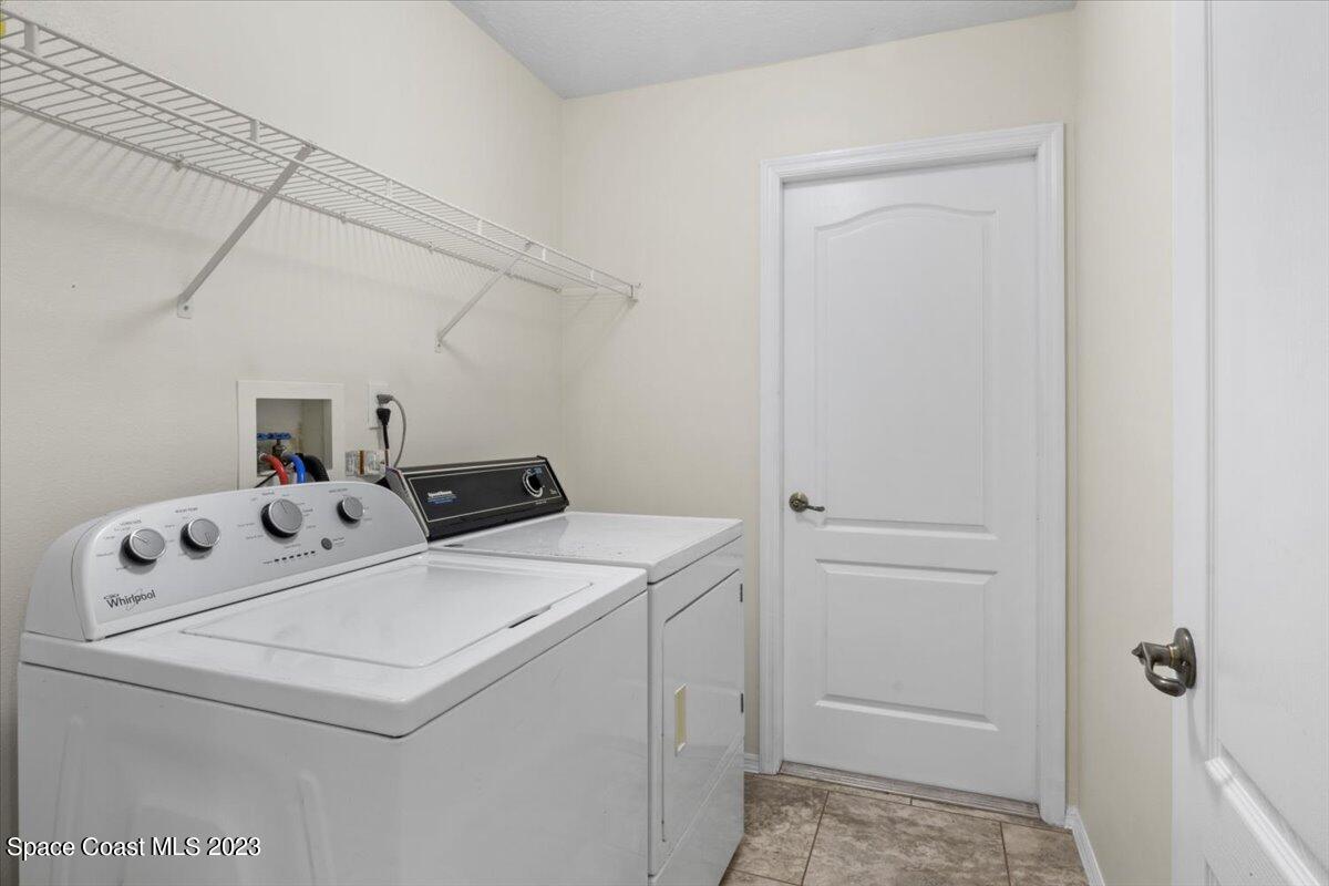 2405 Ruffner Road Melbourne, FL 32901 - Photo 22 of 35 a utility room with dryer and washer
