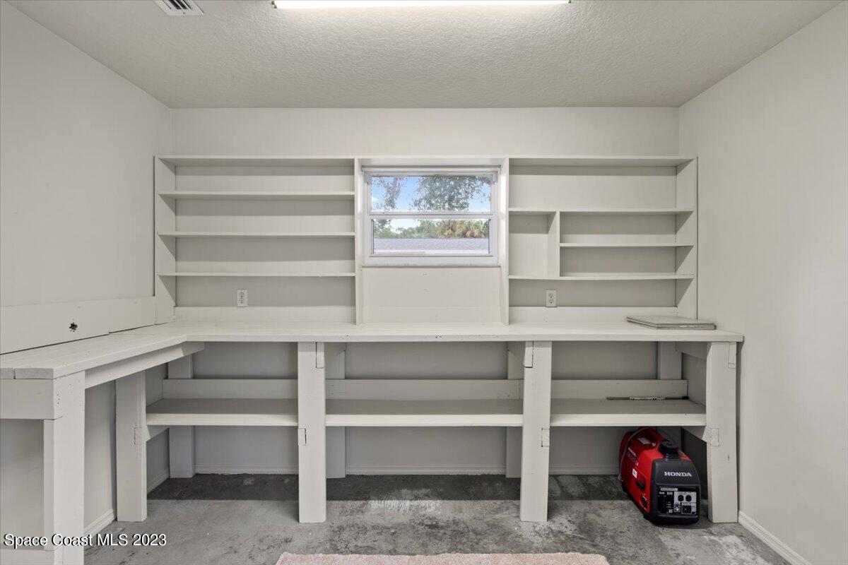 2405 Ruffner Road Melbourne, FL 32901 - Photo 26 of 35 a view of a room with rack on the wall